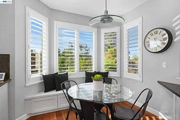 a view of a dining room with furniture window and outside view