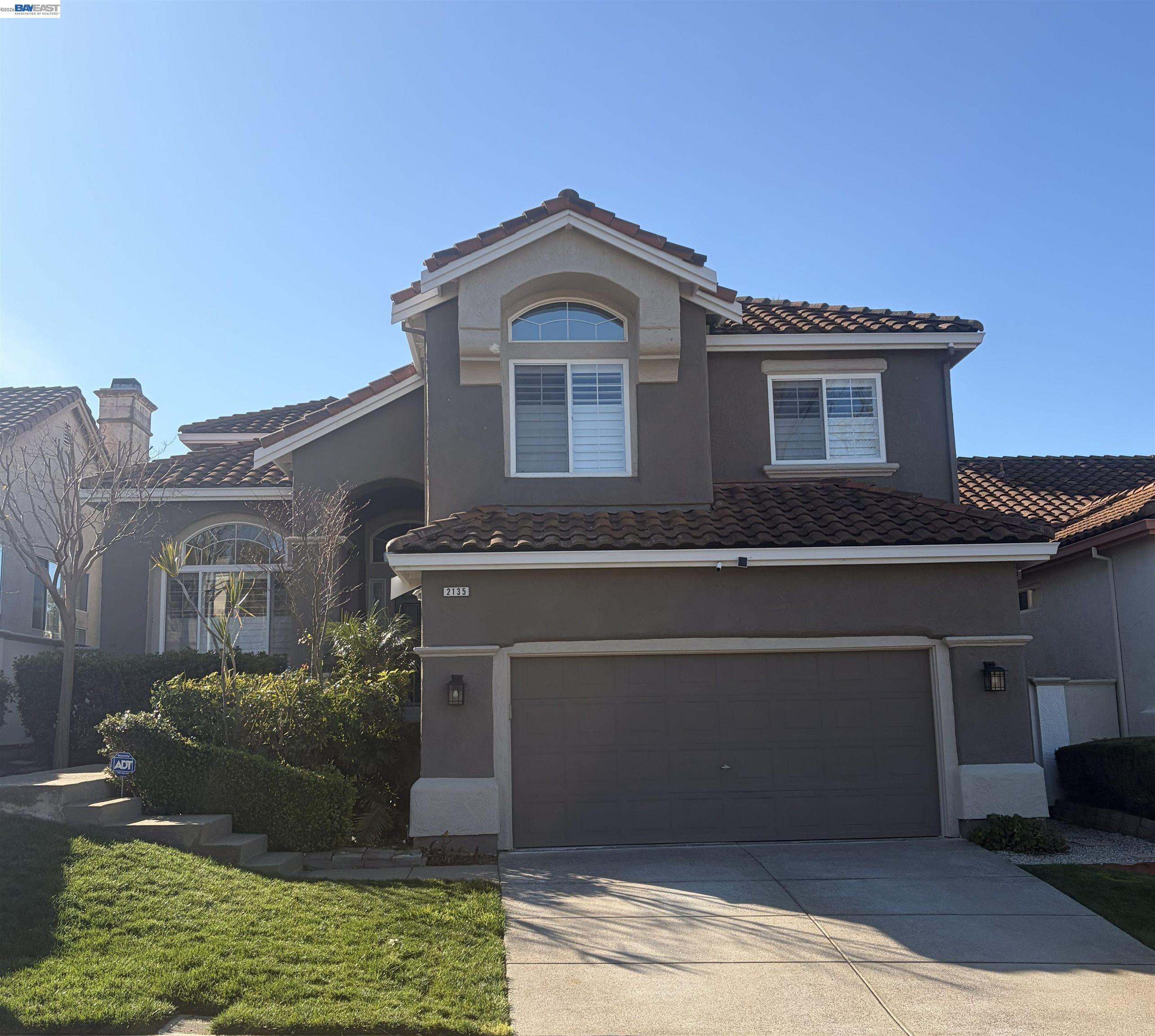 2135 Bluerock Circle Concord, CA 94521 - Photo 2 of 2 a front view of a house with a yard