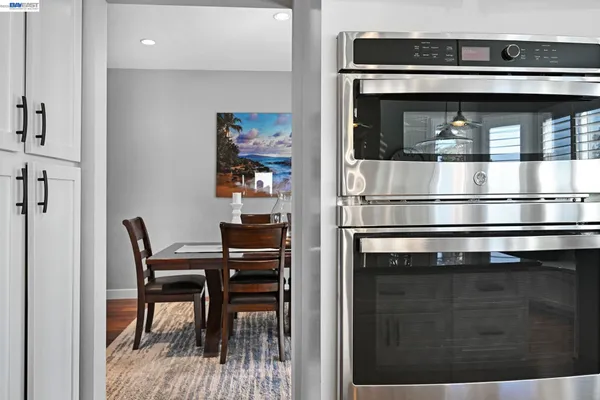 a kitchen with a table and chairs