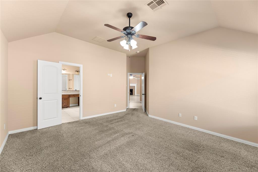 8245 Edgepoint Trail Fort Worth, TX 76053 - Photo 17 of 28 a view of an empty room with a ceiling fan