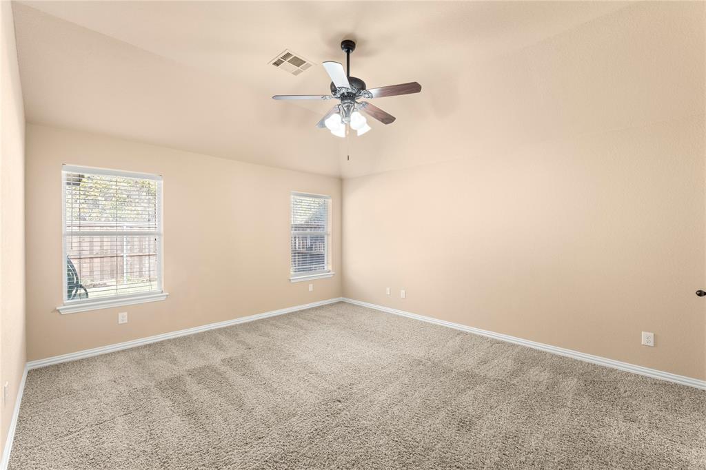 8245 Edgepoint Trail Fort Worth, TX 76053 - Photo 22 of 28 an empty room with windows and fan
