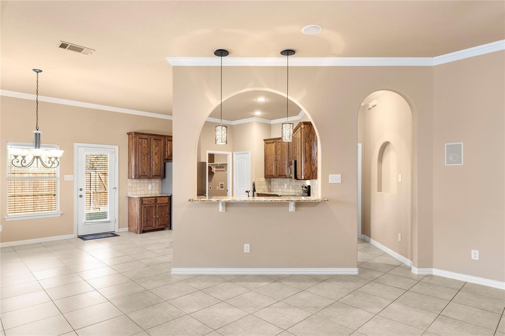 8245 Edgepoint Trail Fort Worth, TX 76053 - Photo 10 of 28 a view of living room with fireplace and chandelier