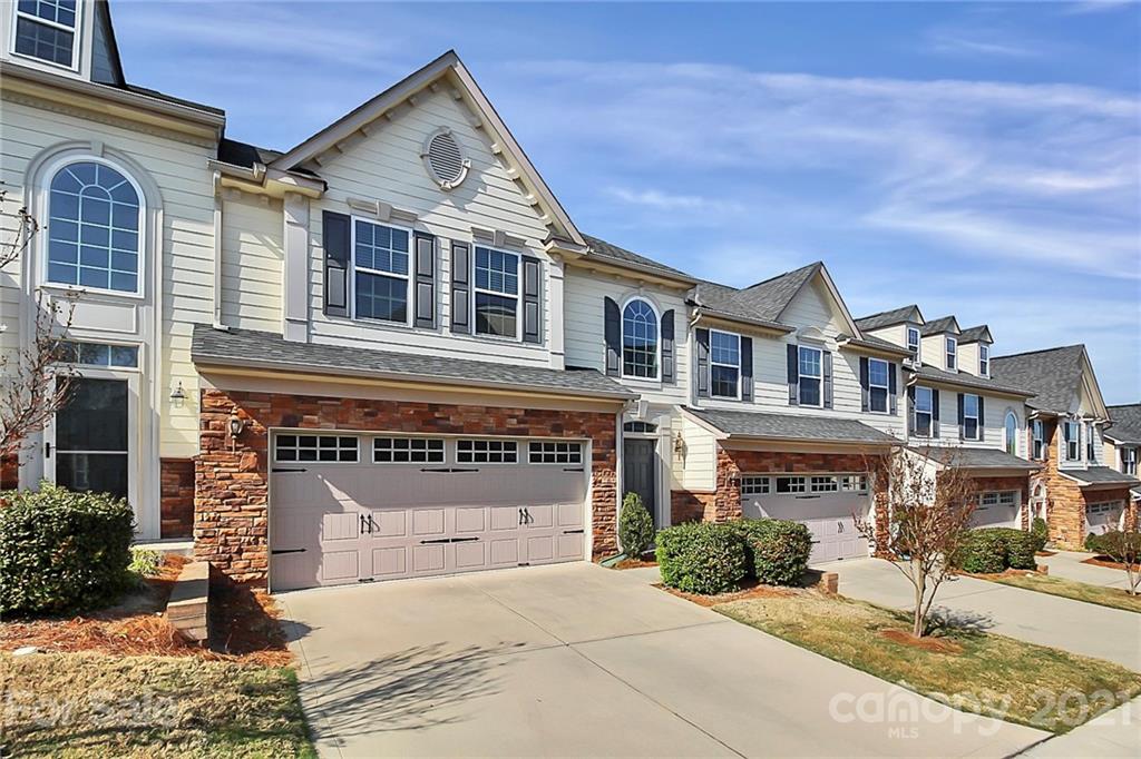 109 Inlet Point Drive Tega Cay, SC 29708 - Photo 2 of 48 a front view of a house with a yard