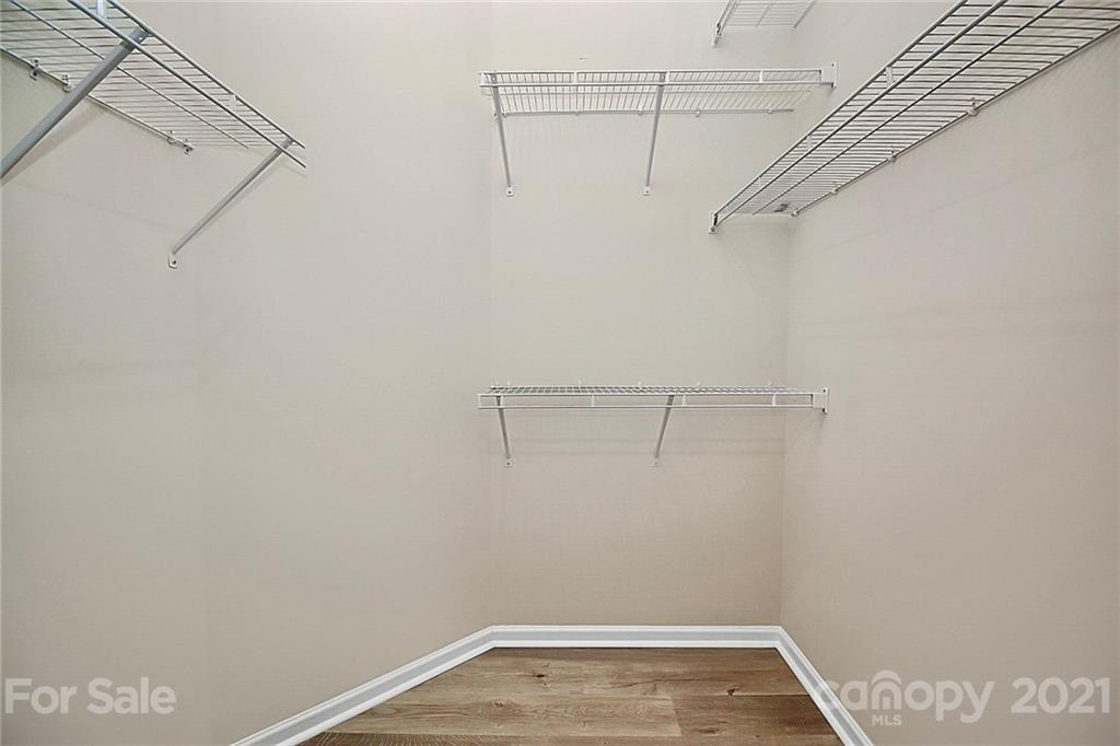 109 Inlet Point Drive Tega Cay, SC 29708 - Photo 18 of 48 a view of a room with racks on the wall