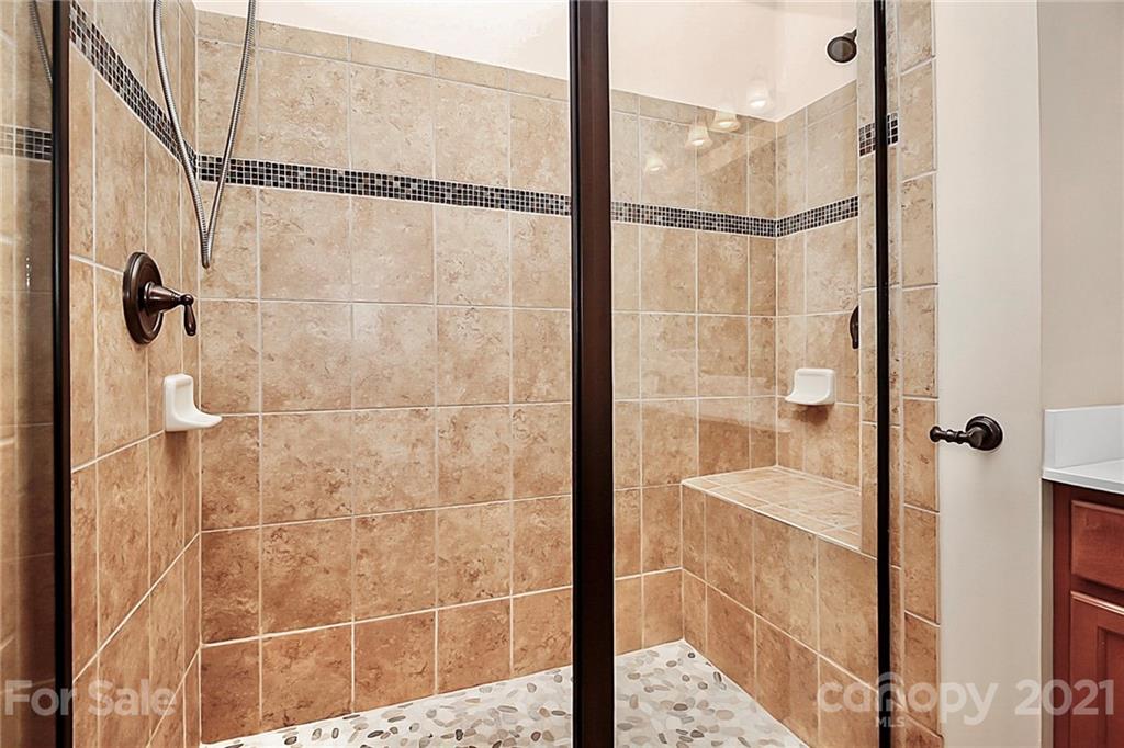 109 Inlet Point Drive Tega Cay, SC 29708 - Photo 21 of 48 a bathroom with a shower