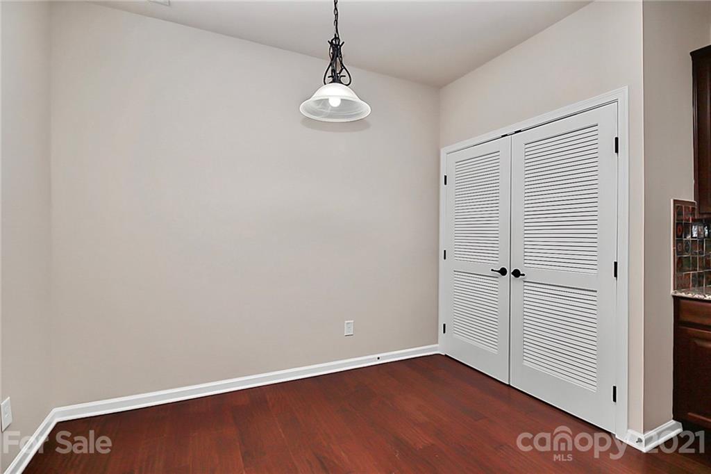 109 Inlet Point Drive Tega Cay, SC 29708 - Photo 22 of 48 a view of an empty room with wooden floor and a window