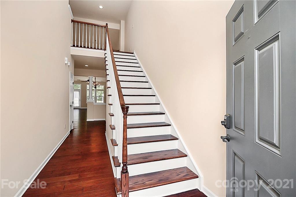 109 Inlet Point Drive Tega Cay, SC 29708 - Photo 24 of 48 a view of a hallway with wooden floor and entryway