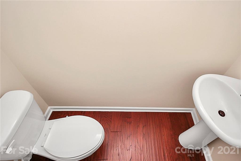 109 Inlet Point Drive Tega Cay, SC 29708 - Photo 25 of 48 a bathroom with a toilet and a mirror