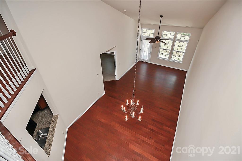 109 Inlet Point Drive Tega Cay, SC 29708 - Photo 27 of 48 wooden floor in an empty room with a window