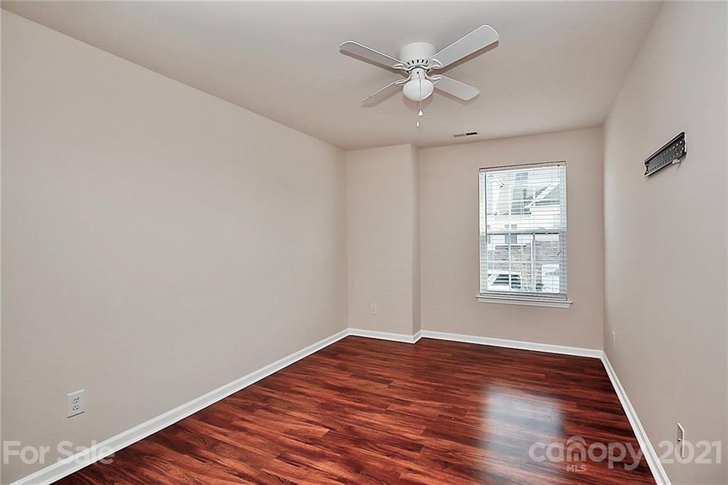 109 Inlet Point Drive Tega Cay, SC 29708 - Photo 28 of 48 an empty room with wooden floor and window
