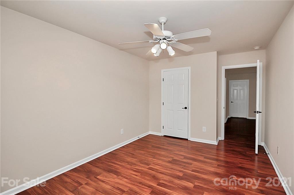109 Inlet Point Drive Tega Cay, SC 29708 - Photo 31 of 48 a view of an empty room and wooden floor