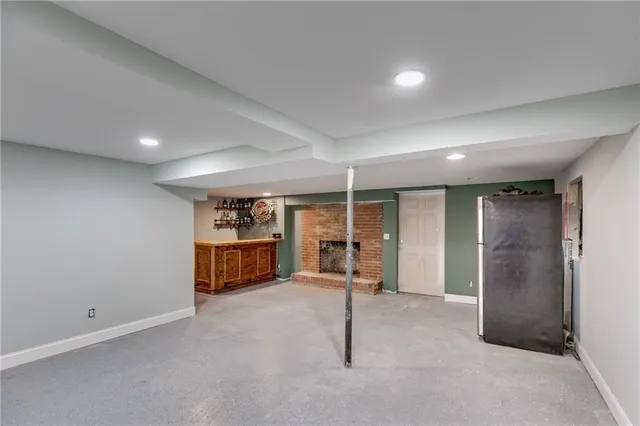 an empty room with furniture and a window