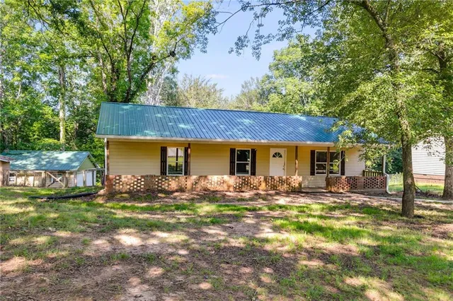 a front view of a house with yard