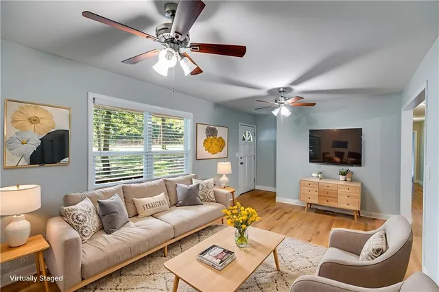 a living room with furniture and a flat screen tv