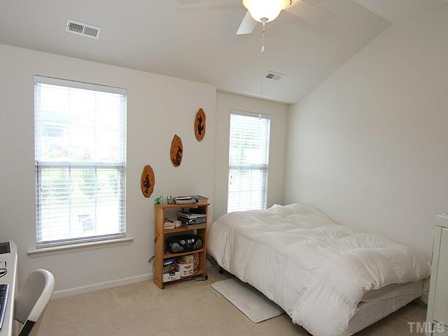 5317 Daleview Drive Raleigh, NC 27610 - Photo 11 of 14 a bedroom with a bed and a window