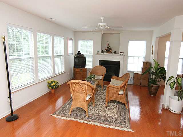 5317 Daleview Drive Raleigh, NC 27610 - Photo 2 of 14 a living room with fireplace furniture and a large window