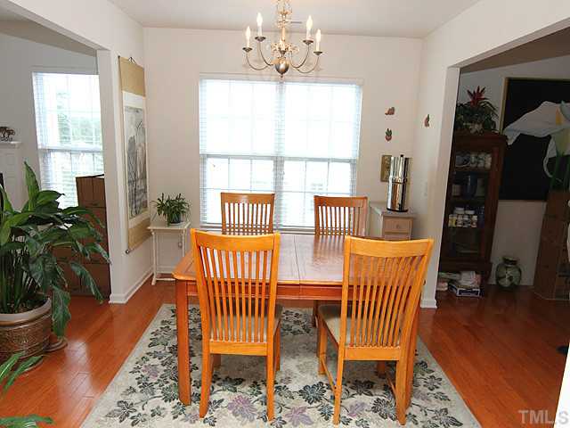 5317 Daleview Drive Raleigh, NC 27610 - Photo 5 of 14 a view of a dining room with furniture window and wooden floor