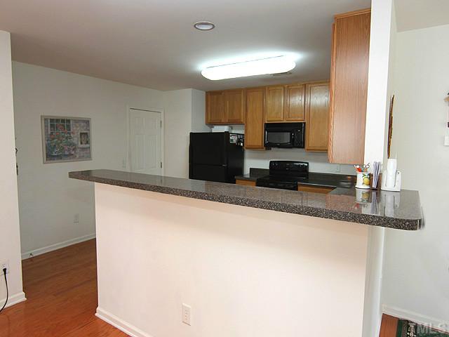 5317 Daleview Drive Raleigh, NC 27610 - Photo 6 of 14 a large kitchen with granite countertop cabinets and a sink