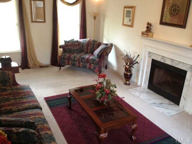 4109 Old Coach Road Raleigh, NC 27616 - Photo 3 of 25 You'll love the firepalce and the size of this room.