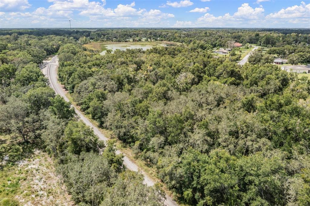 0 Kent Grove Drive Spring Hill, FL 34610 - Photo 15 of 16 an aerial view of a houses with a yard