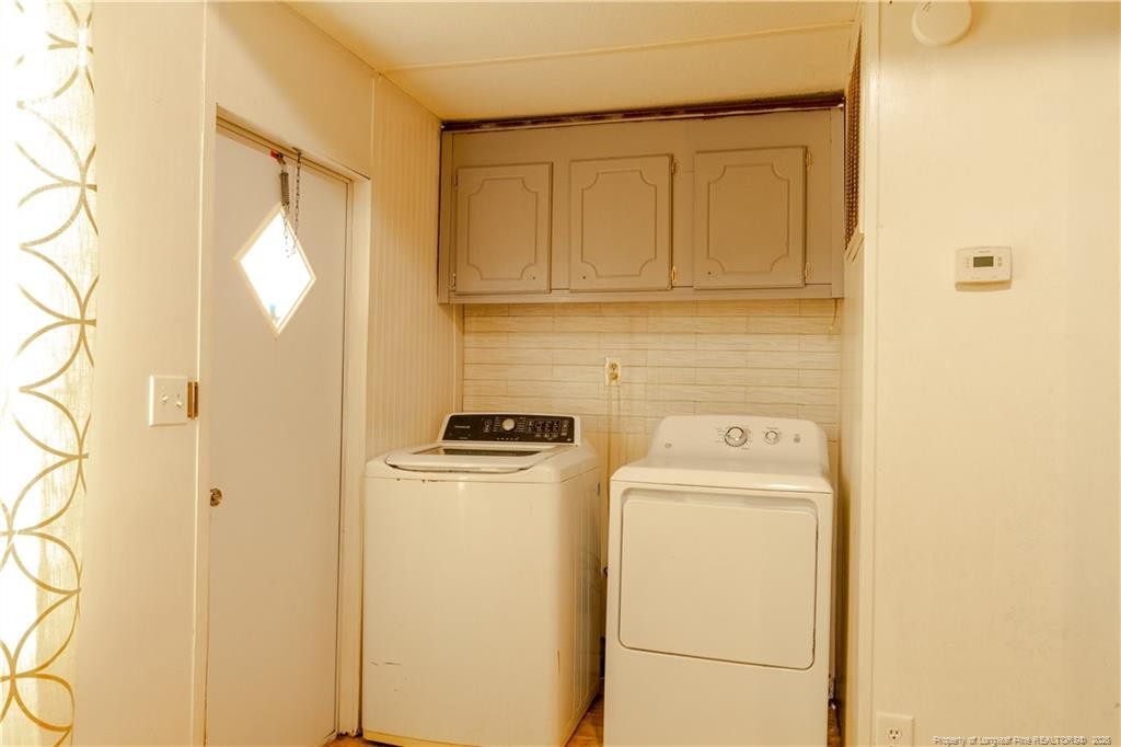 231 Knight Lane Autryville, NC 28318 - Photo 19 of 27 a utility room with dryer and washer