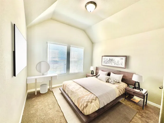 a bedroom with a bed and window