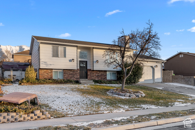 1827 South 350 East Springville, UT 84663 - Photo 1 of 1 View of front of home featuring a garage and a mountain view