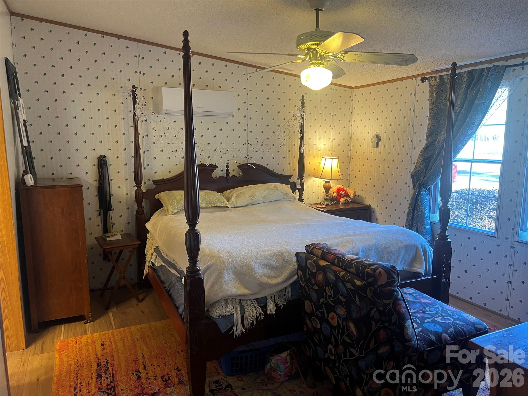 2082 Mary D Road, Unit 1 Chesterfield, SC 29709 - Photo 11 of 33 a bedroom with a bed and a chandelier