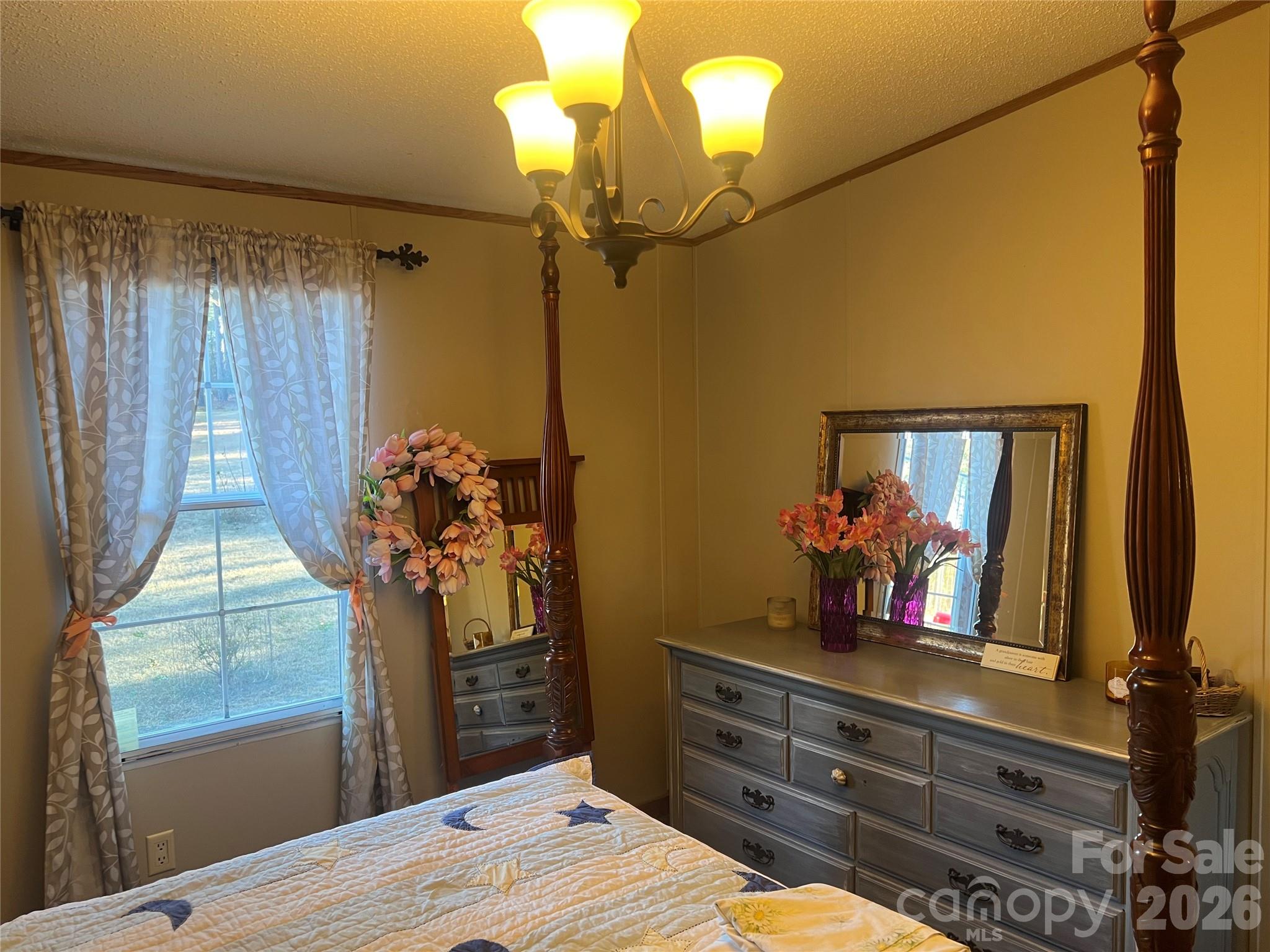 2082 Mary D Road, Unit 1 Chesterfield, SC 29709 - Photo 12 of 33 a bedroom with a bed and a mirror on the dresser