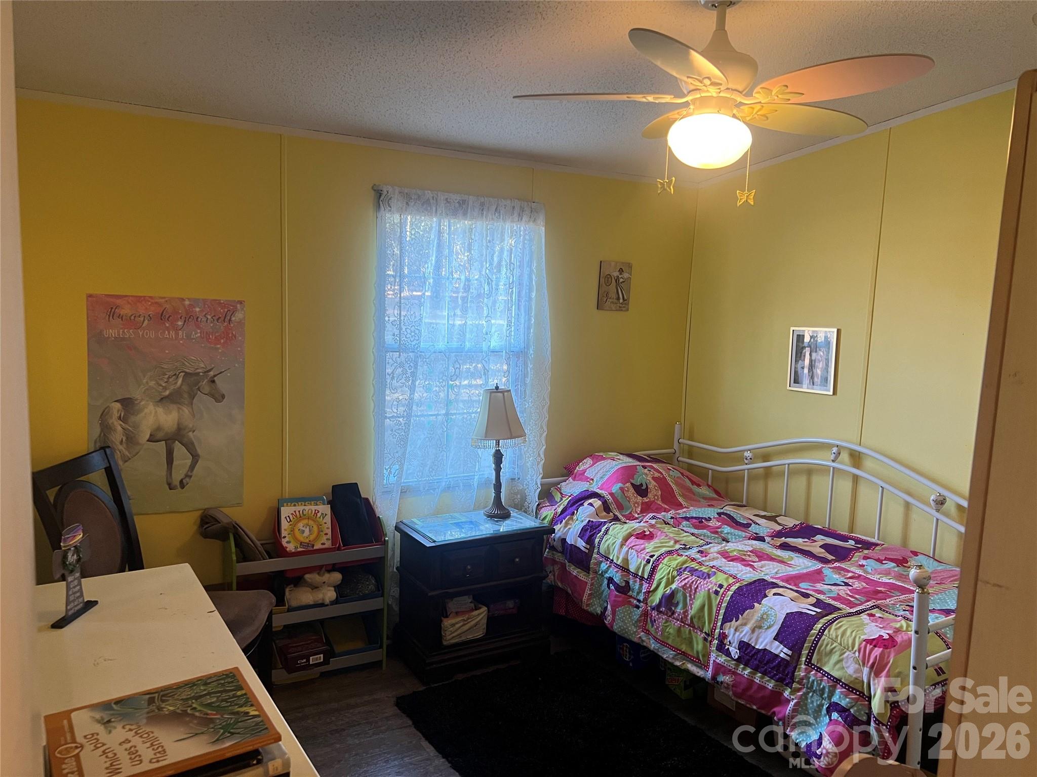 2082 Mary D Road, Unit 1 Chesterfield, SC 29709 - Photo 13 of 33 a bedroom with a bed and a table in it