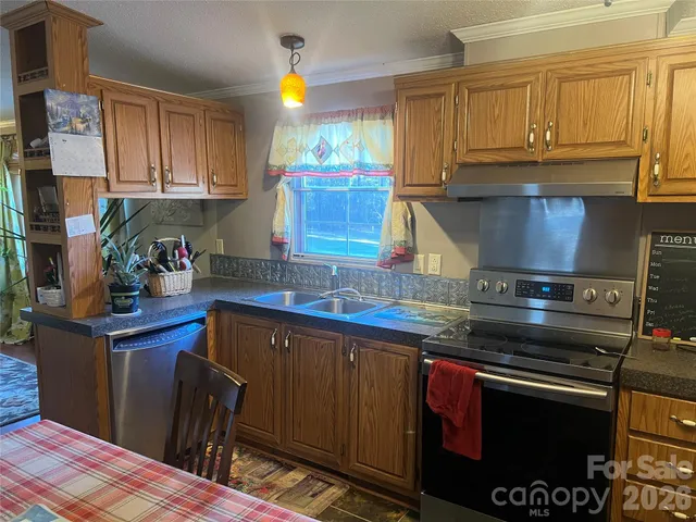 a kitchen with a stove and a sink
