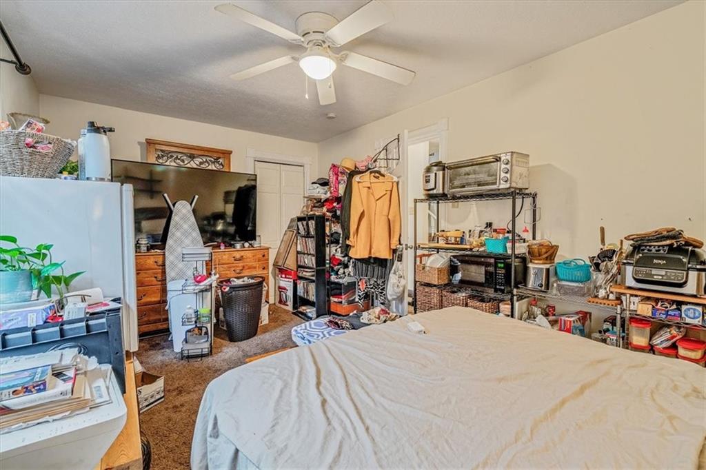 1211 Davidson Street Aliquippa, PA 15001 - Photo 29 of 50 a bedroom with bed and a chair