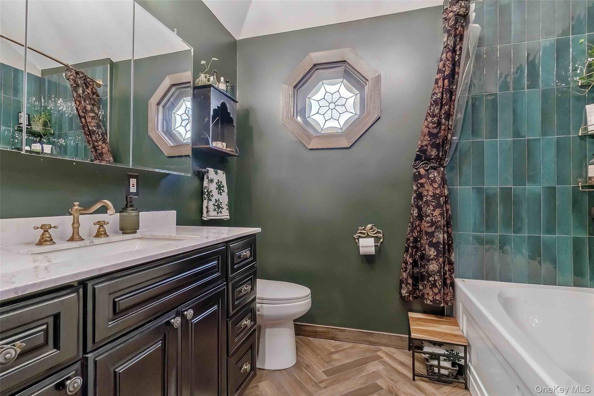27 West 11th Road Queens, NY 11693 - Photo 8 of 18 Full bathroom featuring vanity, a tub to relax in, and a shower with curtain