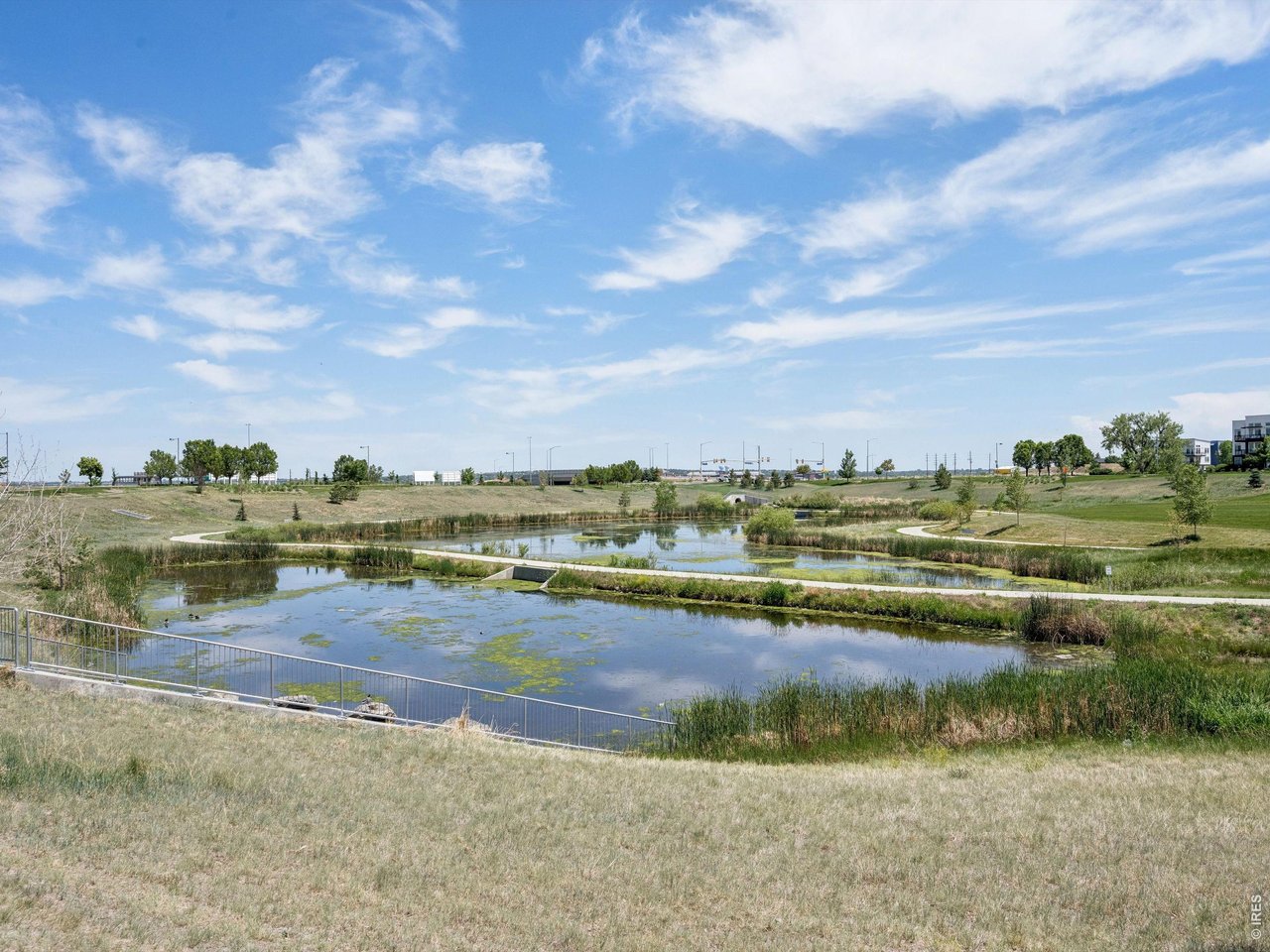 11202 Colony Circle Broomfield, CO 80021 - Photo 23 of 23 a view of a lake with houses in the back