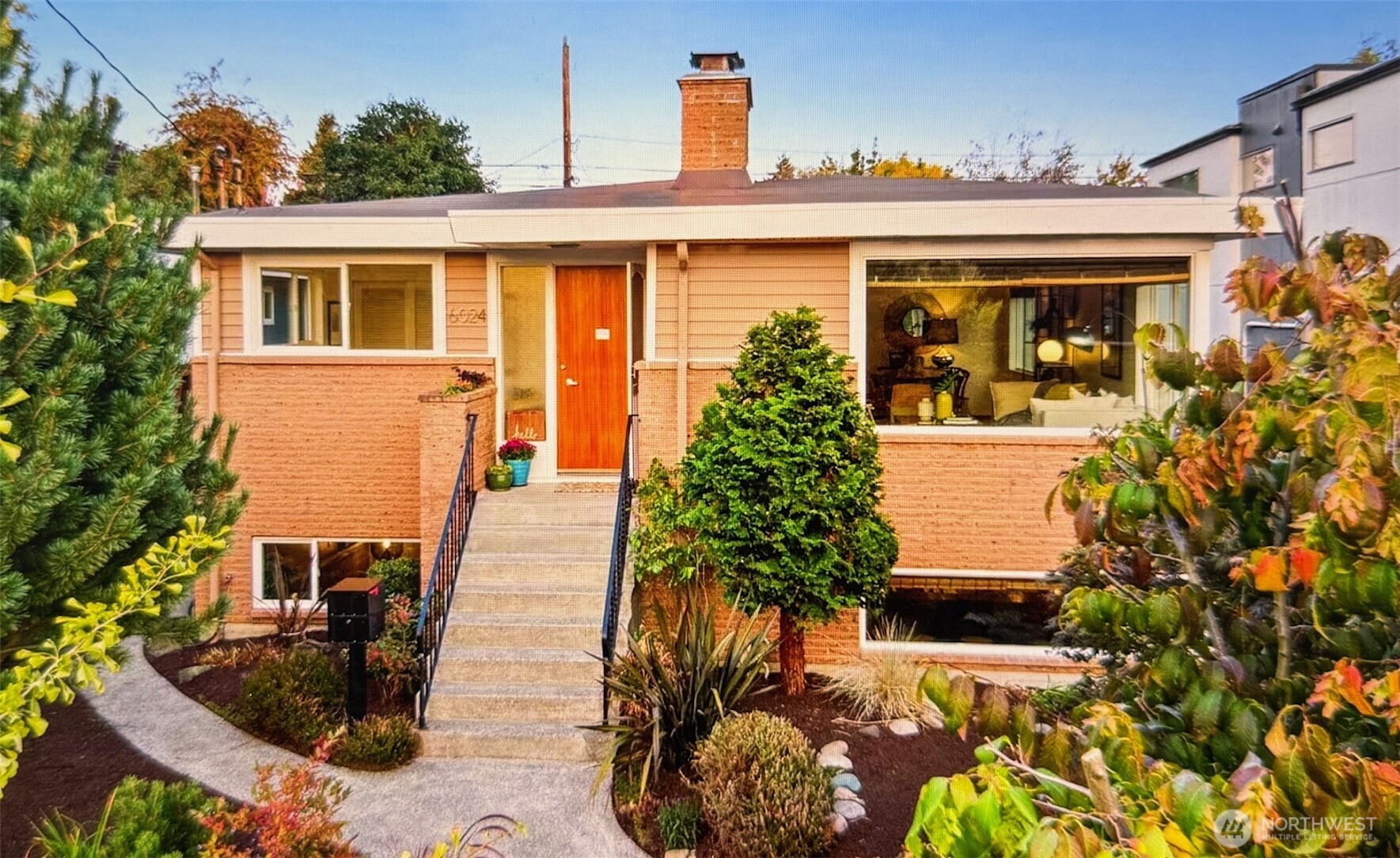 front view of a house with a potted plant