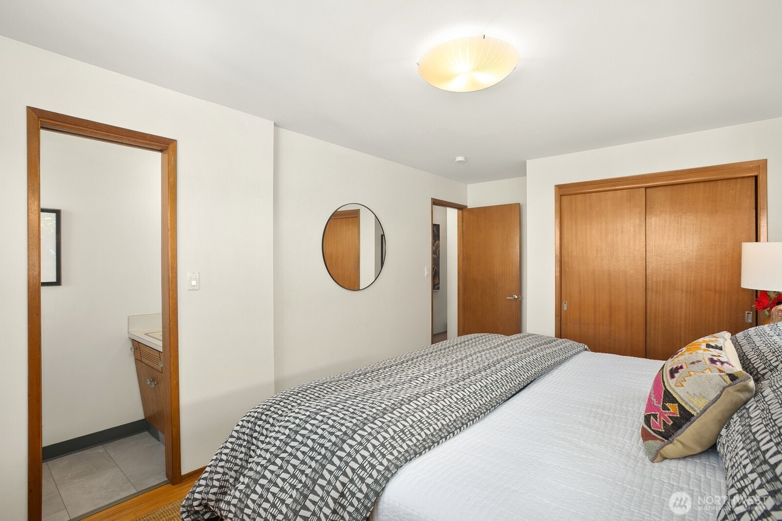 6024 48th Avenue Southwest Seattle, WA 98136 - Photo 11 of 40 a bedroom with a bed and a window