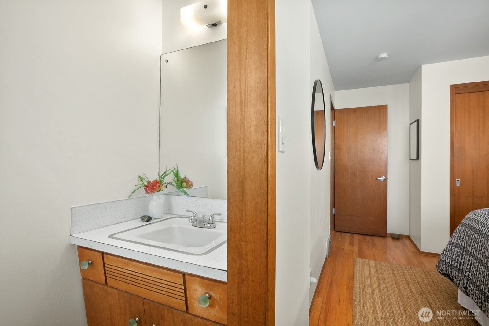 6024 48th Avenue Southwest Seattle, WA 98136 - Photo 12 of 40 a bathroom with a sink and a mirror
