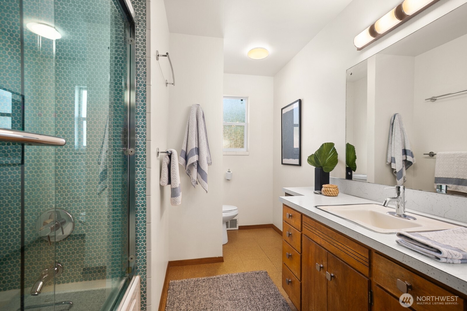 6024 48th Avenue Southwest Seattle, WA 98136 - Photo 15 of 40 a bathroom with double vanity and a shower