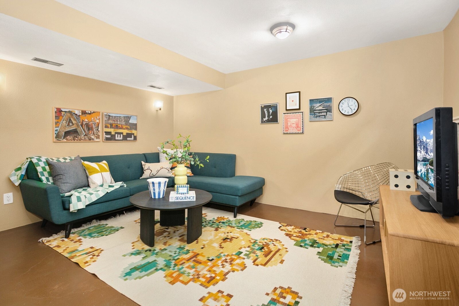 6024 48th Avenue Southwest Seattle, WA 98136 - Photo 21 of 40 a living room with furniture and a flat screen tv