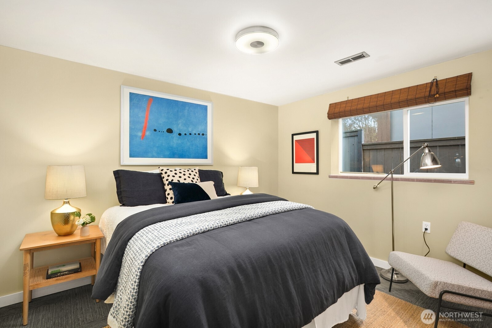 6024 48th Avenue Southwest Seattle, WA 98136 - Photo 23 of 40 a bedroom with a bed and wooden floor