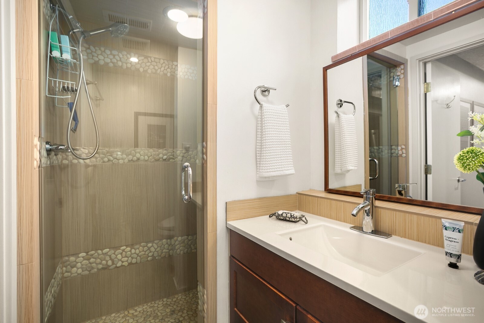 6024 48th Avenue Southwest Seattle, WA 98136 - Photo 25 of 40 a bathroom with a sink and mirror