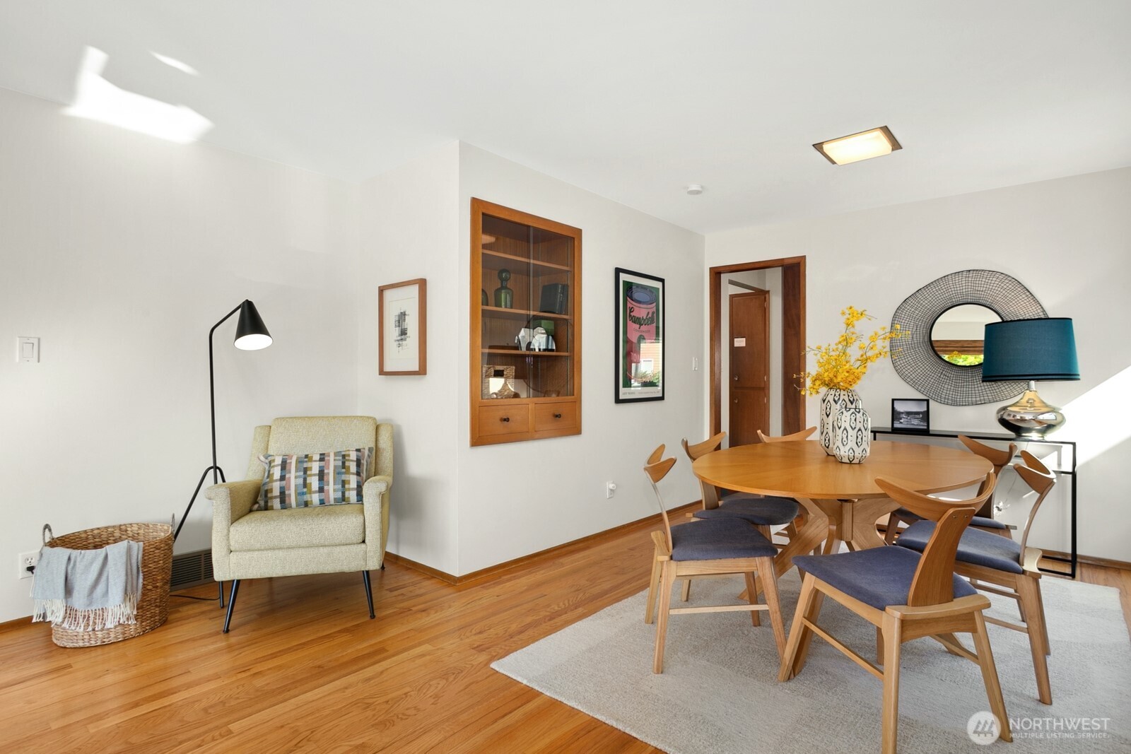 6024 48th Avenue Southwest Seattle, WA 98136 - Photo 4 of 40 a view of a dining room with furniture and wooden floor
