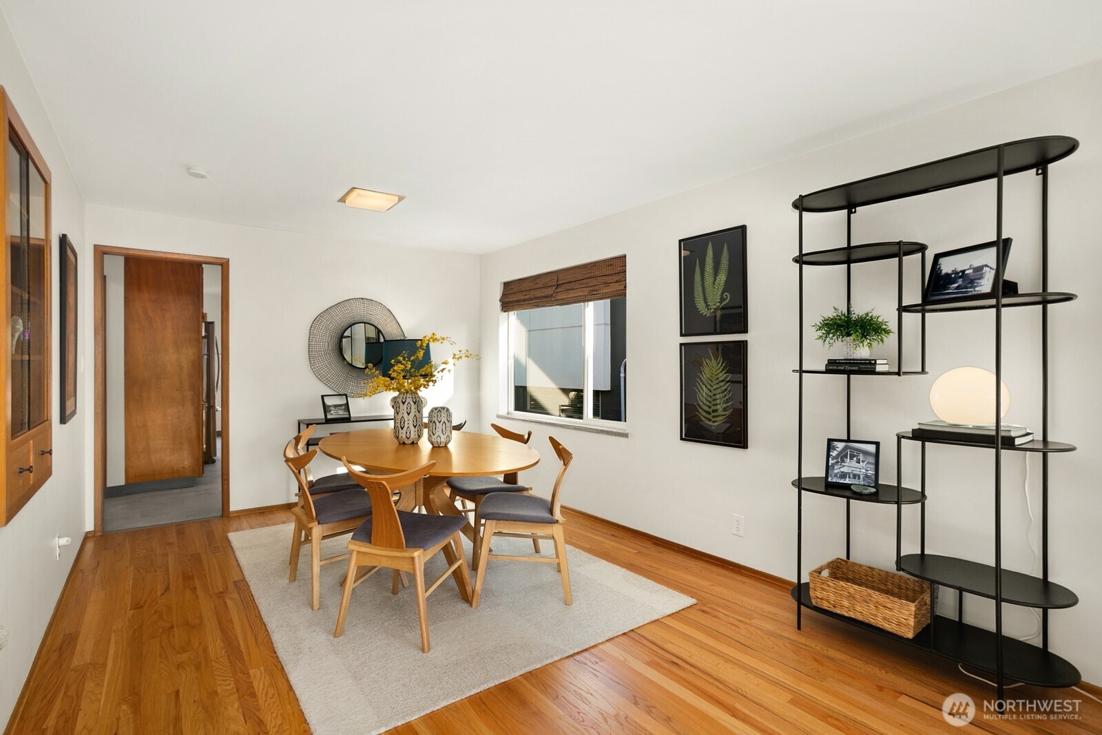 6024 48th Avenue Southwest Seattle, WA 98136 - Photo 5 of 40 a view of a dining room with furniture window and wooden floor