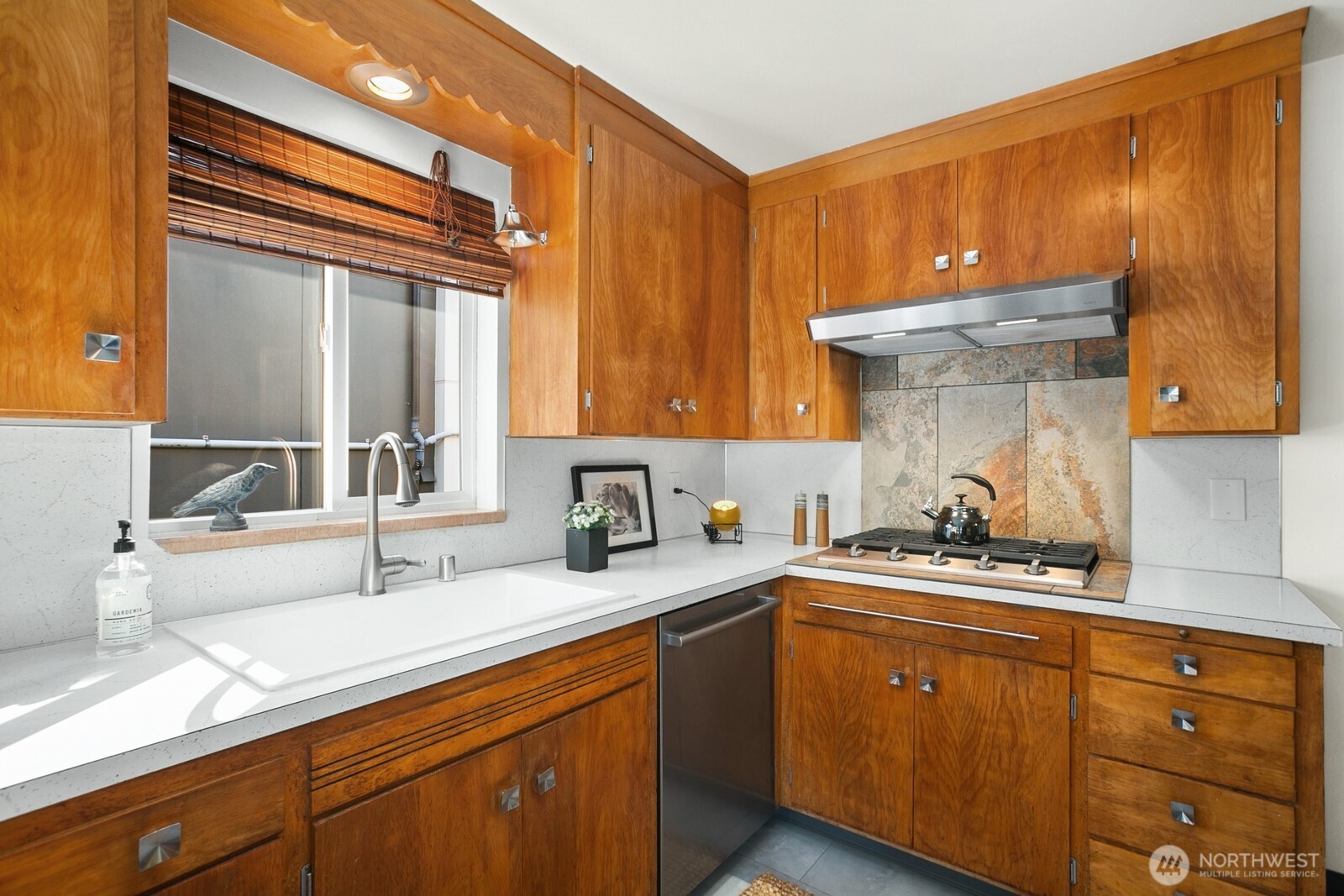 6024 48th Avenue Southwest Seattle, WA 98136 - Photo 9 of 40 a kitchen with a sink and cabinets