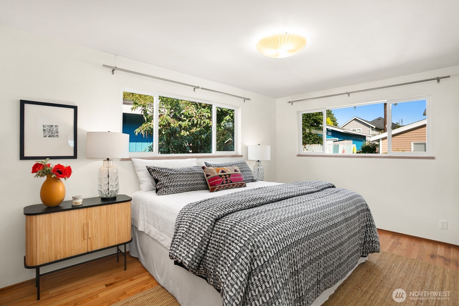6024 48th Avenue Southwest Seattle, WA 98136 - Photo 10 of 40 a bedroom with a bed and a window