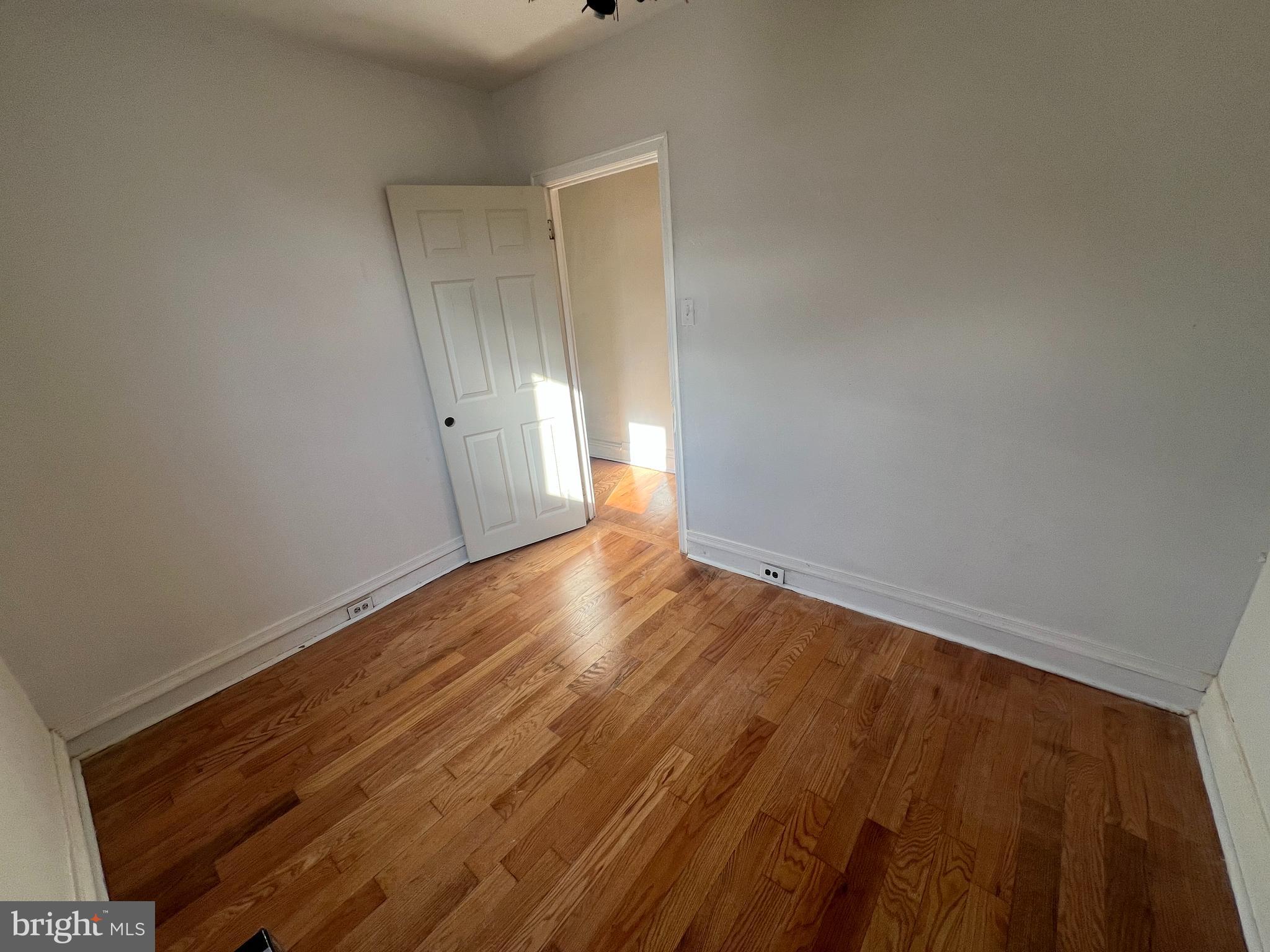 1319 South 22nd Street, Unit 2 Philadelphia, PA 19146 - Photo 9 of 9 a view of an empty room with wooden floor