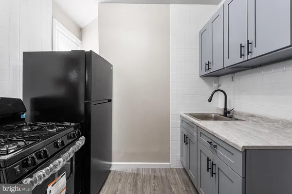 a view of cabinets with wooden floor
