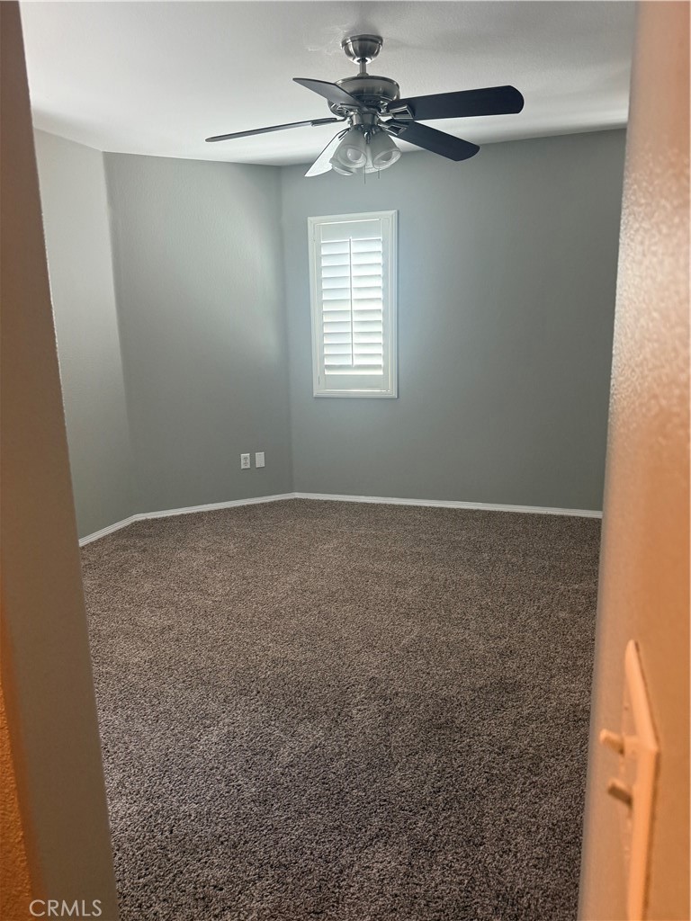 8692 East 9th Street, Unit 38 Rancho Cucamonga, CA 91730 - Photo 19 of 31 a view of room with window and ceiling fan