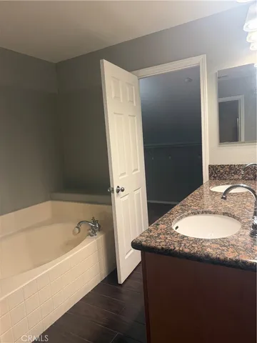 a white toilet sitting next to a shower