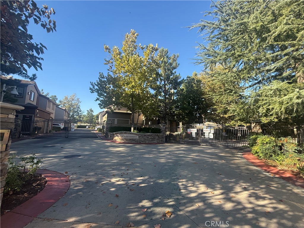 8692 East 9th Street, Unit 38 Rancho Cucamonga, CA 91730 - Photo 2 of 31 a front view of a house with a yard
